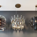 Three Stylish Modern Chandeliers With Geometric Metal Frames And Bright Lights