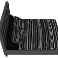 Grey Upholstered Double Bed With Tufted Headboard And Striped Bedding In Bedroom