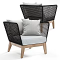 Modern Rattan Lounge Chair With Wooden Legs And Soft Gray Seat Cushions
