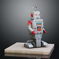 Vintage Robot Toy Figure With Red Arms Control Panel And Antenna On Base