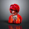 Portrait Of Elderly Man With Red Turban White Beard And Red Robe In Gray Background