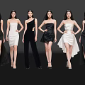 Group of Women in Stylish Black and White Dresses Posing Gracefully on Black Background
