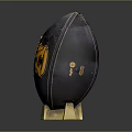 Black Football Sports Equipment With Golden AC Logo And Golden Stand Base