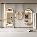 Three Round and Oval Mirrors With Lighting Wall Mounted Near Plants and Decorative Paintings