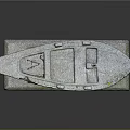 Gray Stone Boat Sculpture on Decorative Wave Pattern Base with Textured Surface