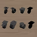 Set of Metal Casters with Various Designs Placed on Wooden Floor