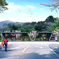 Park Station Entrance With Cherry Blossom Trees Green Vegetation Blue Sky And People Walking