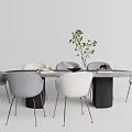 Modern Round Dining Table Set With Gray White Chairs Black Base And Small Plant 3d model