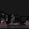 Photo Check In Spot With Black Display Walls Pink Flowers Curved Path And Picture Displays
