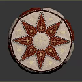 Round Decorative Cushion In Red And White With Star Pattern And Stitched Edges