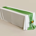 Decorated Long Table With White Tablecloth Green Ribbon And Yellow Flower