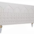 Elegant White Console Cabinet With Carved Patterns And Gold Accent Legs