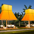 Orange Tents With Palm Trees Mountain Backdrop Blue Sky And Wooden Deck With Tables Chairs