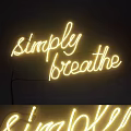 Glowing Yellow Simply Breathe Neon Sign Decor On Dark Wall