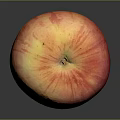 Fresh Ripe Red Apple With Sticker On Dark Reflective Surface