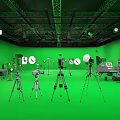Green Screen Studio Setup With Professional Photography Equipment Tripods Lighting And Cameras