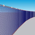 Blue Mesh Hanging Decor with Red Edges Curved Over Gray Ground and Blue Sky
