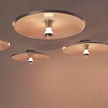 Three Modern Wall Lamps On Wall With Round Shades And Visible Light Bulbs