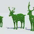 Green Shrub Deer Topiary Sculptures in Three Different Sizes with White Accents