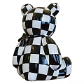 Black And White Checkered Toy Bear With Shiny Surface And Golden Foot Decorative Details