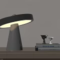 Modern Table Lamp With Minimalist Design On Wooden Cabinet And Stacked Books