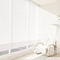 White Venetian Blinds on Window in Modern Interior with Rocking Chair and Light Patterns