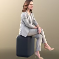 Elegant Woman in Gray Suit Set Sitting on Black Cube with Light Brown Background
