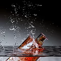 Perfume Bottle Displaying Splashing Liquid On Black Background For Visual Scene 3d model
