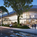 Modern Commercial Street With Glass Facade Trees Pedestrians And Evening Lights