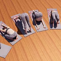 Multiple Women Practicing Yoga Poses On Wooden Floor With Yoga Mats