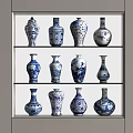 Blue and White Floral Vases with Various Designs Displayed on Shelves