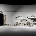 Elegant White Space Design With Arched Doorway And Curved Floral Decorations