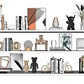 Modern Home Decor Ornament Collection With Sculptures Vase Frames Books And Plants On Shelf