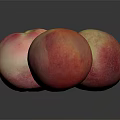 Three Fresh Pink and Yellow Peaches on Dark Background with Reflections