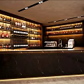 Elegant Bar Interior Design With Black Marble Counter And Stocked Wine Shelves