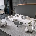 Modern Sectional Sofa and Round Coffee Table Set With Decorative Pillows on Neutral Rug