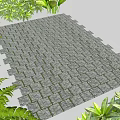 Gray Brick Pavement Surrounded By Lush Green Plants In Garden Area