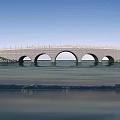 Stone Arch Bridge Spanning Over Calm Water With Blue Sky And Green River Banks