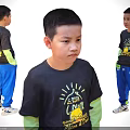 Child Wearing Black T-shirt Yellow Text Green Long Sleeve Undershirt Blue Pants White Sneakers