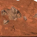 Red Desert Natural Landscape With Undulating Sandy Ground And Rock Formations