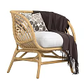 Natural Style Wicker Single Sofa With White Cushion Dark Blanket And Decorative Pillow