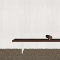 Modern Wooden Bench With Transparent Legs On Pebble Ground Against Gray Wall And Cylindrical Object
