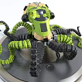Green And Black Mechanical Octopus Model With Intricate Tentacles On Silver Base