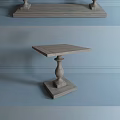 Wooden Coffee Table With Carved Legs And Side Tables Against Gray Wall With Architectural Sketches