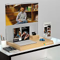 Modern Display Shelf with Books Decorations Laptop and Stationery on Desk
