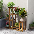 Multi tiered Wooden Plant Stand With Various Potted Flowers And Green Plants Outdoors
