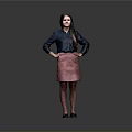 Woman In Blue Shirt And Pink Skirt Standing With Hands On Hips Against Gray Background