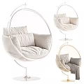Round Golden Frame Hanging Chair With White Cushions And Gray Blanket