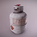 Silver Gray LPG Cylinder With Red Valve And Warning Label On Metal Surface
