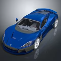 Sleek Blue Sports Car With Modern Aerodynamic Design And Silver Alloy Wheels